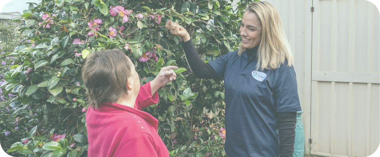 Disability support worker and woman with Down syndrome