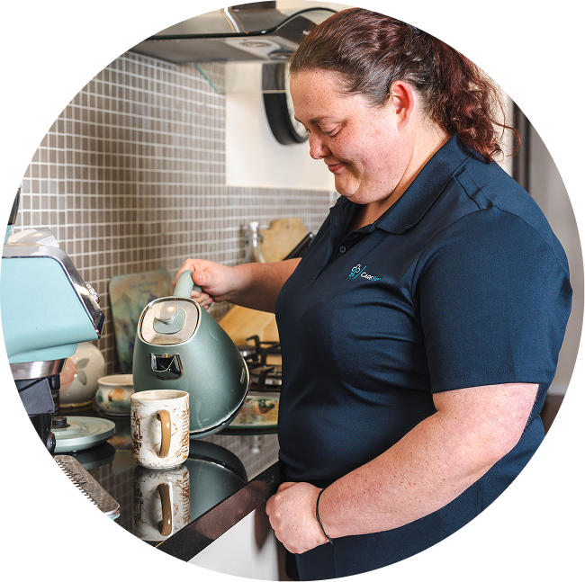 A caregiver from The CareSide delivers the best home care in Geelong while pouring a cup of tea for a home care client.