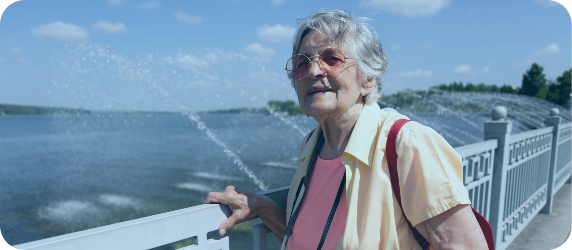 A photo of an older woman in WA looking out over the water at Elizabeth Quay.