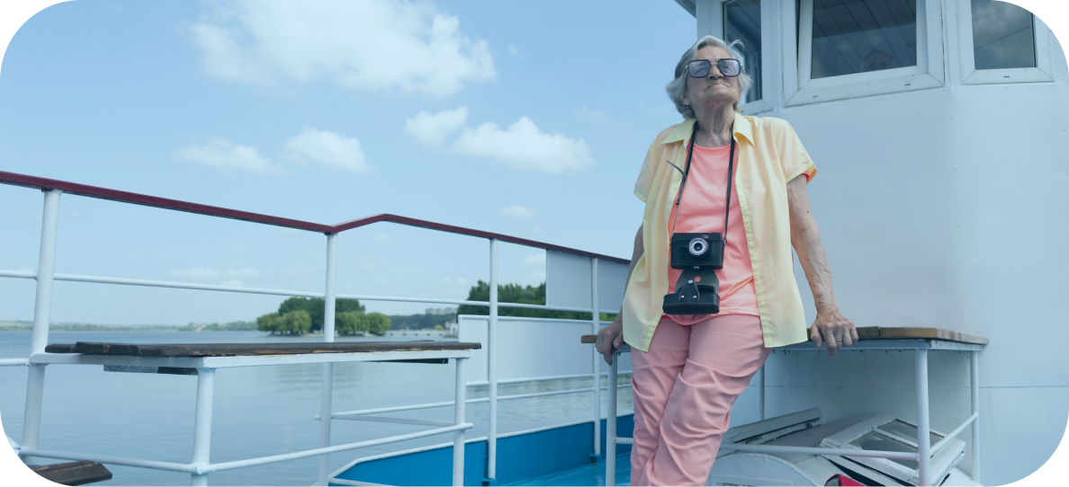 A photo of a senior in Queensland enjoying a cruise on Moreton Bay.