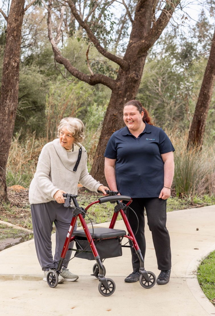 A home care recipient in NSW enjoys a walk with her Port Macquarie support worker from The CareSide.