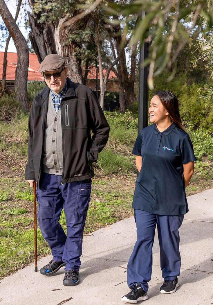 A photo of a home care recipient enjoying a walk with his support worker from The CareSide on the Gold Coast.