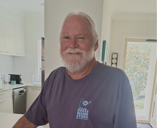 The CareSide client, Ian, smiles for a photo and shares his story about finding affordable aged care in Australia.