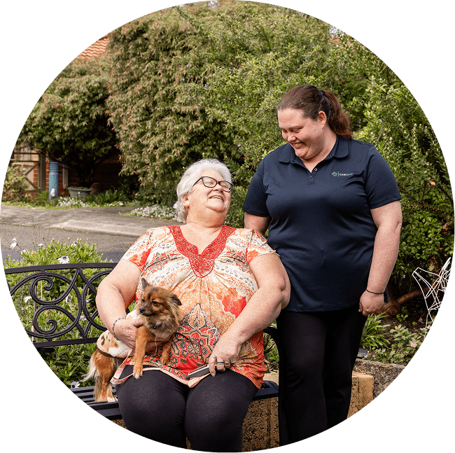A home care recipient in QLD smiles with her support worker from The CareSide. The CareSide provides the best value home care in Townsville.