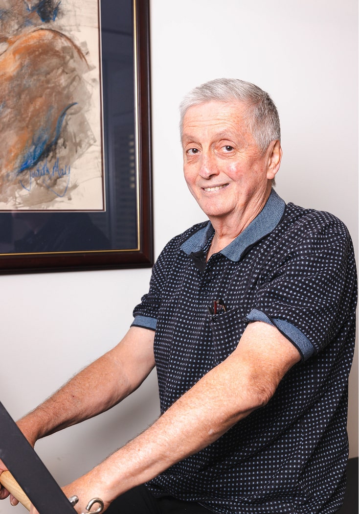 This photo of home care in Rockhampton shows a home care recipient enjoying physical therapy exercises.