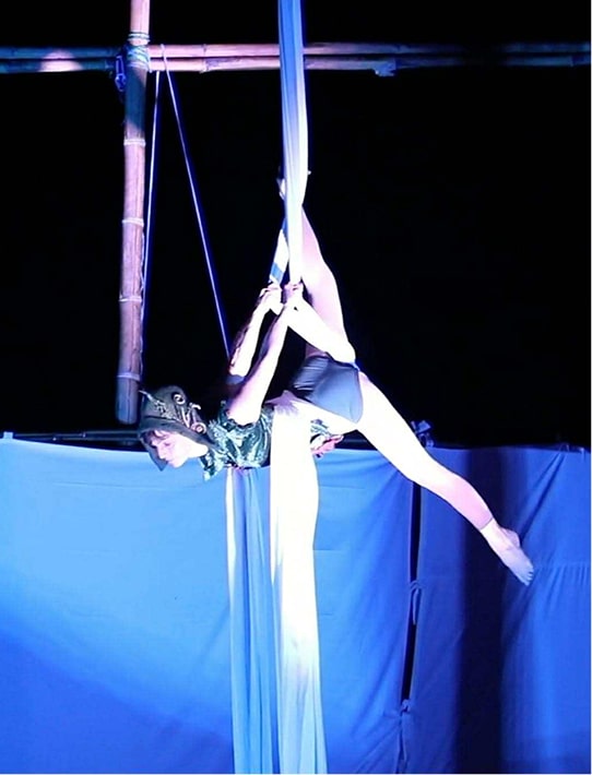 Julie performs aerial acrobatics while suspended in the air. Julie's story is part of The CareSide's Super Seniors series.