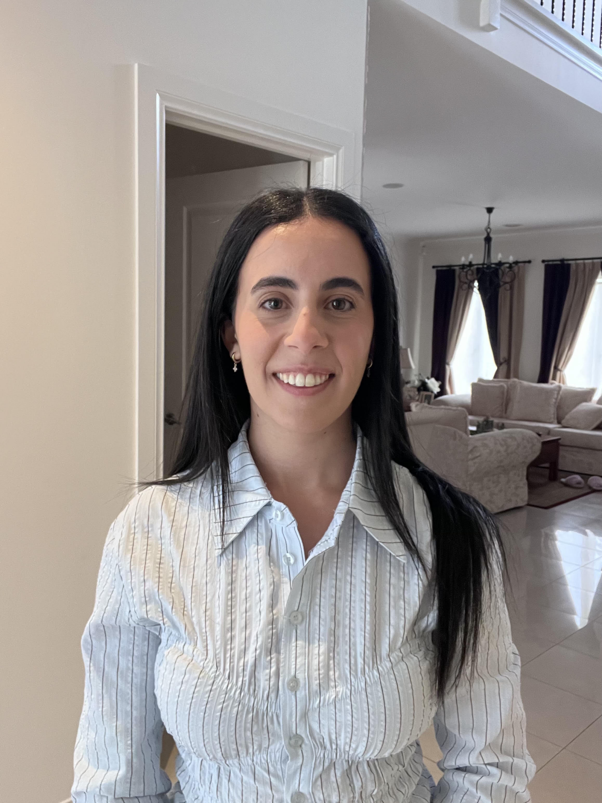 A photo of Angelina, a Care Manager at The CareSide who ensures care recipients like Michael have stable support and continuity of care.