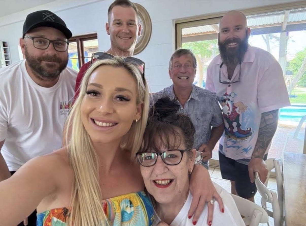 A photo of Janet and her family. Janet lives in a remote region of Australia and couldn't find local home care support until she contacted The CareSide.